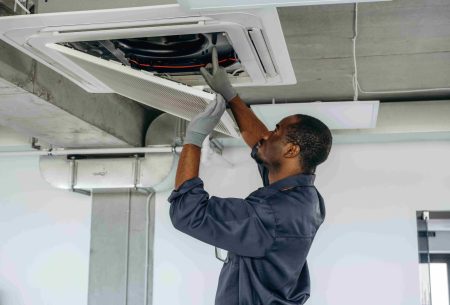 fixing-ventilation-repairman-is-indoors-modern-office_11zon